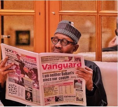 Photo of President Muhammadu Buhari reading a newspaper attracts attention online