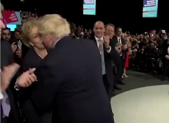 UK Prime Minister Boris Johnson kisses Andrea Leadsom on the lips