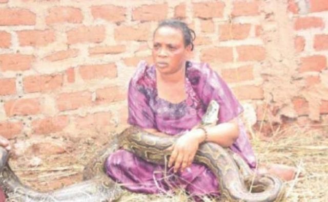 Woman caught breastfeeding a snake