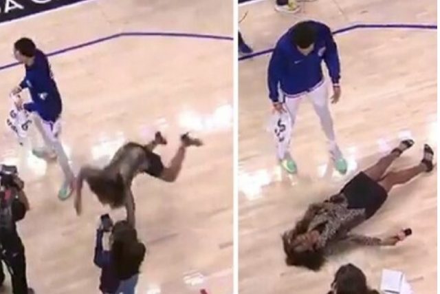 Journalist on duty falls and lands on basketball court after slipping on water