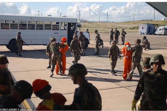 SHOCKING! Never seen before photos of first Guantanamo Bay detainees arriving in blindfolds, shackles and eye protectors released to the public