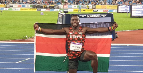 Omanyala with the Kenyan flag after wining men's 100m