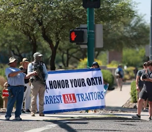 Armed Donald Trump supporters protest outside the FBI office in Phoenix following the Mar-a-Lago search
