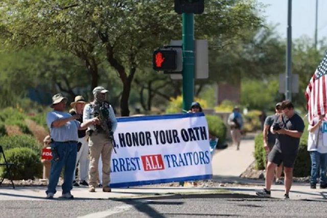 Armed Donald Trump supporters protest outside the FBI office in Phoenix following the Mar-a-Lago search
