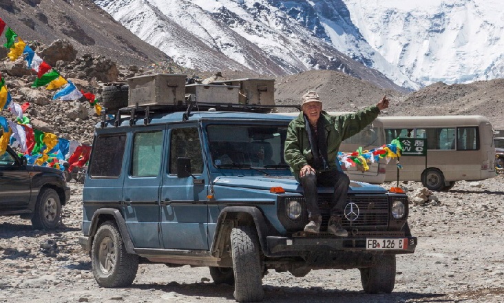 Gunther Holtorf sitting on the bonnet of Otto